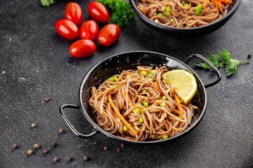 Buckwheat noodles soba in a bowl fresh dish Asian cuisine on the table rustic food top view copy space