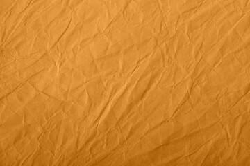 Abstract wrinkled golden crumpled paper texture background