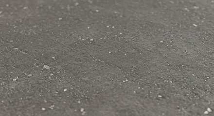 Close up of speckled gray surface texture for backgrounds and designs with neutral color scheme effect