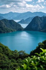 Fototapeta premium a view of a lake surrounded by mountains and trees