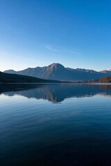 arafed view of a lake with mountains in the distance