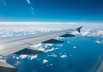 Obraz premium Airplane Wing Over Ocean Clouds