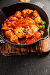 Butter chicken curry poultry meat tomato sauce dish fresh tasty gourmet food background on the table rustic food top view copy space