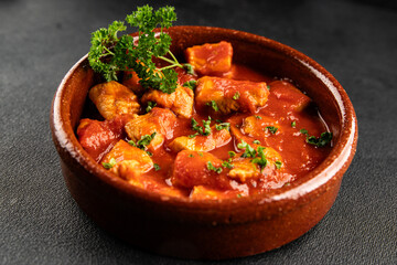 Butter chicken curry poultry meat tomato sauce dish fresh tasty gourmet food background on the table rustic food top view copy space