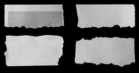 Torn papers on black