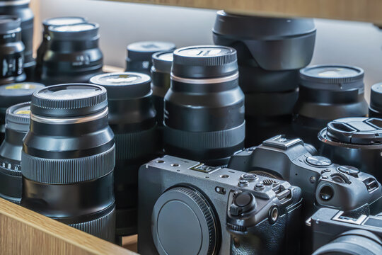 Lots of cameras on the shelf and Photo lenses for rent. Large selection of professional cameras and lenses available for rental at local photography shop