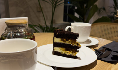  cake dessert accompanied by a cup of coffee on the table. Favorite delicious coffee cake. Cup of espresso coffee