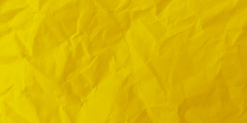Closeup of yellow crumpled paper for texture background. 