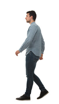 Full length side view portrait of a confident man walking isolated on transparent background