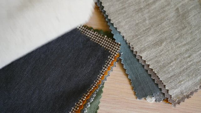 Fabric samples for sewing bed linen and home textiles. Palette with multi-colored linen scraps, stock video