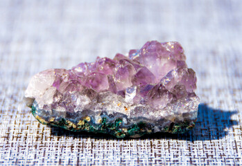 Natural mineral amethyst. Semi-precious multi-colored stones, minerals close-up. Mineralogy....