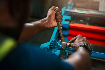 Skilled Factory Worker, Technician Performing Heavy Industrial Machine Maintenance In Modern Plant