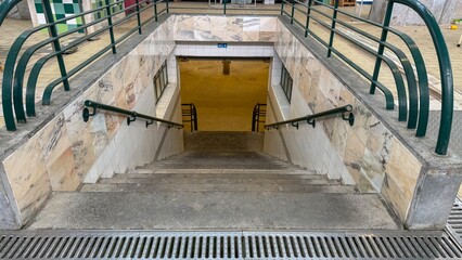 Descending marble stairs lead to an eerie portal of urban exploration, ideal for Travel Tuesday and...