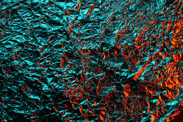 green and red shiny aluminum foil texture close up