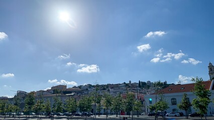 Bright halcyon skies bathe a tranquil Mediterranean town, perfect for Nomad Day musings or Sunlit Essence celebrations