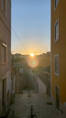 Sunset over cobblestone alley whispers tales of Fados heartache, evoking Portugal's Saudade soul...