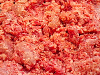 Abundance of shredded pork. Preparing raw pork.