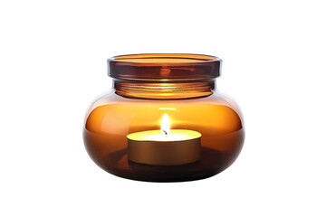 An amber glow emanates from a delicate candle within a glass jar creating a peaceful cozy on...