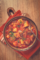 Potatoes with meat, stewed in tomato sauce, with spices and herbs, homemade, no people,