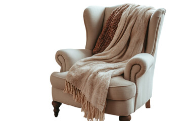 An inviting armchair draped with cozy blankets evokes a sense of calm and relaxation for quiet on...