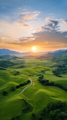 Fototapeta premium Sunset over rolling green hills serene landscape nature photography tranquil environment aerial view scenic beauty