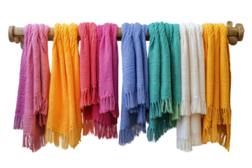 Colorful handwoven towels draped on a rustic wooden rack evoke the warmth of a coastal spa on transparent background