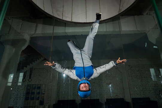 A woman flies in a wind tunnel. Free fall simulator.