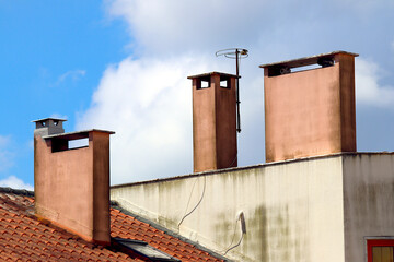 Chimneys on the roof of a building.
