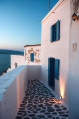 Greek architecture: White walls and blue accents overlooking the ocean. Serene Mediterranean vista at dawn.