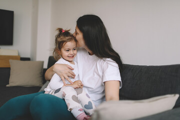 Happy young mother with her little daughter
