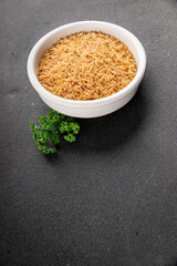 Brown rice whole grain cereal healthy product superfood fresh tasty gourmet food background on the table rustic food top view copy space keto and paleo diet vegetarian and vegan food