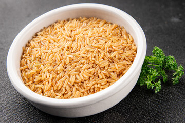 Brown rice whole grain cereal healthy product superfood fresh tasty gourmet food background on the table rustic food top view copy space keto and paleo diet vegetarian and vegan food