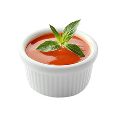 Red sauce in a white bowl garnished with basil leaves