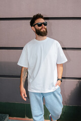 White T-shirt on a bearded hipster in sunglasses — urban mockup for brands