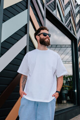 White T-shirt on a bearded hipster in sunglasses — urban mockup for brands