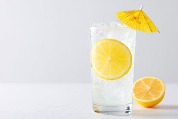 minimalistic composition of cool drink glass with cocktail umbrella sits isolated on pristine white background