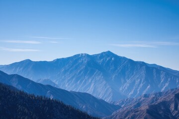 serene mountain range under clear blue sky