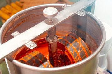 Chocolate machine. Industrial stirring of chocolate. Machines consistency rollers mixing factory stir the chocolate mixture in stainless steel containers.