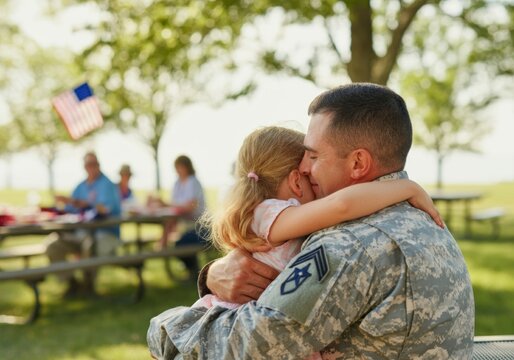 Emotional reunion: military father embracing daughter at outdoor family picnic