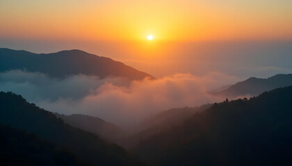Obraz premium Serene Sunset Glow Through Thick Evening Fog in Mountain Landscape