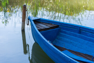 Obraz premium Detail of the colorful boat resting on the lake