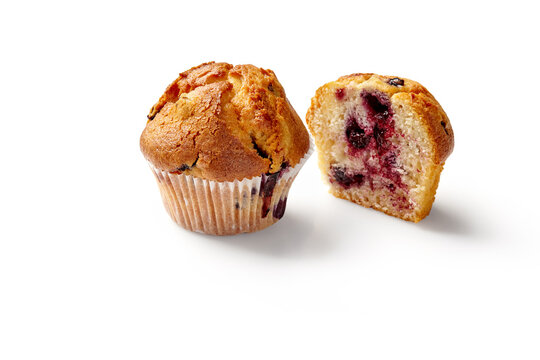 Delicious blueberry muffins isolated on white background showing its fluffy inside