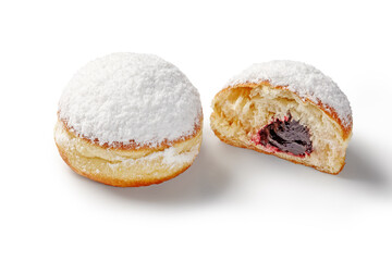 Two delicious jelly doughnuts, one cut open showing filling, covered with powdered sugar