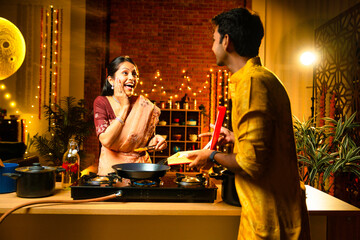Gifting necklace to wife, Indian husband surprises her while she cooks in festive kitchen