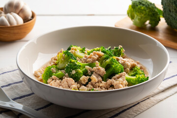 Stir fried broccoli with minced pork in white plate.Thai Healthy food.
