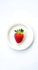 Strawberry on a Plate: A perfectly ripe strawberry rests delicately on a pristine white plate, a simple yet vibrant composition of natural sweetness and visual appeal.