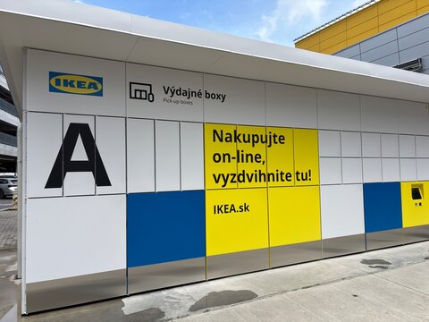 Bratislava, Slovakia - May 18, 2025: IKEA self service parcel lockers for online order pick-up, located outdoors with bold branding in Slovak language.