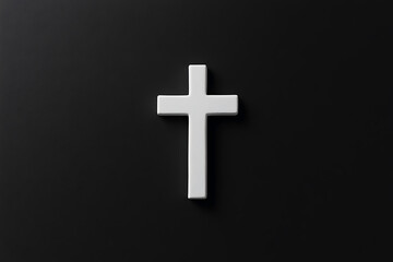 Obraz premium Minimalist Image: A white cross is placed centrally against a dark background, symbolizing faith and simplicity with a focus on visual contrast.