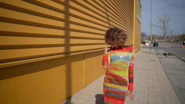 This editorial features vibrant fashion that pops against a bold yellow background
