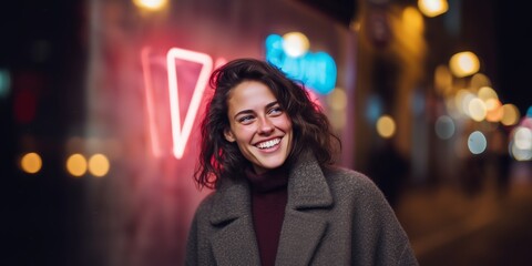 Evening city scene with smiling woman by neon lights